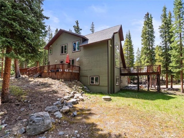 50 Sunset Dr, Breckenridge, CO 80424 - rear view of property with stairs, a wooden deck, and a lawn