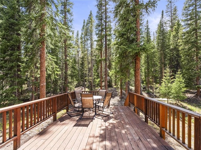 50 Sunset Dr, Breckenridge, CO 80424 - deck featuring outdoor dining area and a forest view