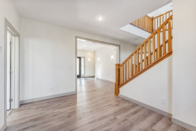 unfurnished room featuring light hardwood / wood-style floors