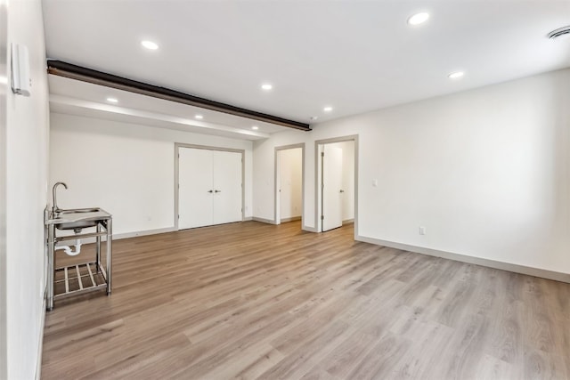 basement with light wood-type flooring