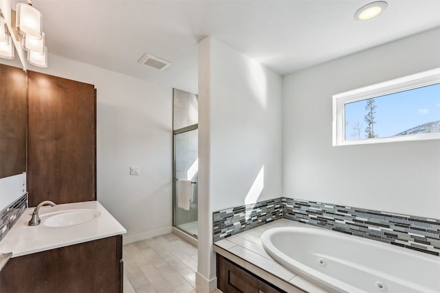 bathroom featuring hardwood / wood-style floors, vanity, and independent shower and bath