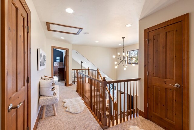 73 Chestnut Ln Unit 73, Breckenridge, CO 80424 - hall with light colored carpet, attic access, an upstairs landing, and recessed lighting