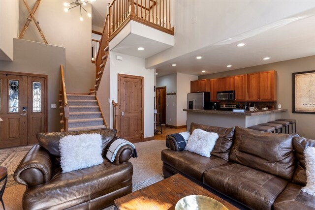 73 Chestnut Ln Unit 73, Breckenridge, CO 80424 - living room with baseboards, recessed lighting, light colored carpet, a high ceiling, and stairs