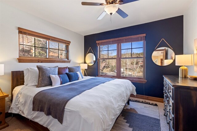 73 Chestnut Ln Unit 73, Breckenridge, CO 80424 - carpeted bedroom featuring ceiling fan and multiple windows