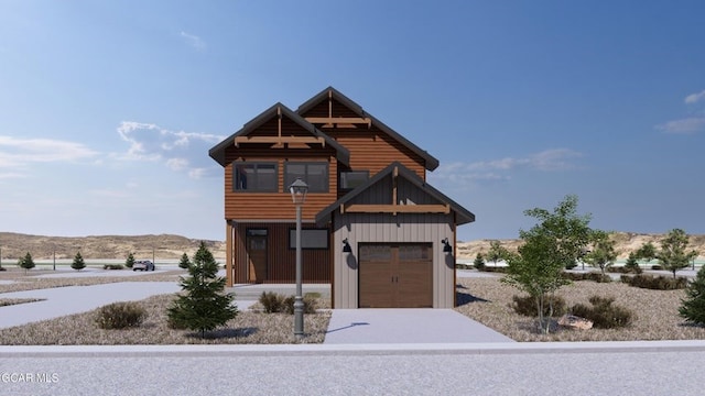 371 Buckhorn Cir, Granby, CO 80446 - view of front of house featuring a garage, driveway, and board and batten siding