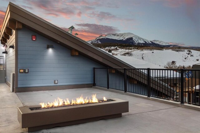 exterior space with concrete floors and a mountain view