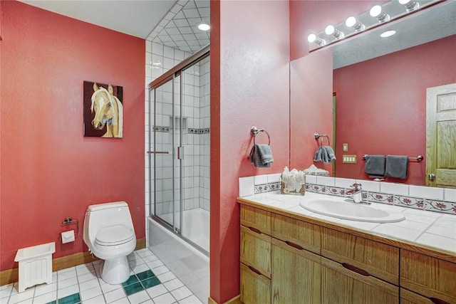 348 Jade Rd, Silverthorne, CO 80498 - bathroom featuring vanity, toilet, bath / shower combo with glass door, tile patterned flooring, and baseboards