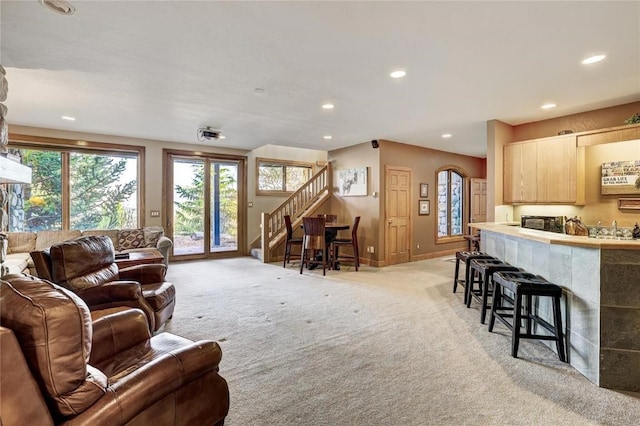 348 Jade Rd, Silverthorne, CO 80498 - living room featuring light carpet, stairway, recessed lighting, and baseboards