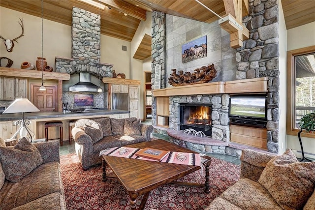 348 Jade Rd, Silverthorne, CO 80498 - living room featuring a fireplace, wooden ceiling with exposed beams, and high vaulted ceiling