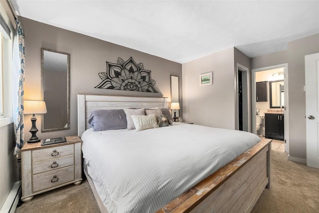26 Cypress Ct Unit 26, Steamboat Springs, CO 80487 - bedroom featuring a baseboard heating unit, carpet, and connected bathroom