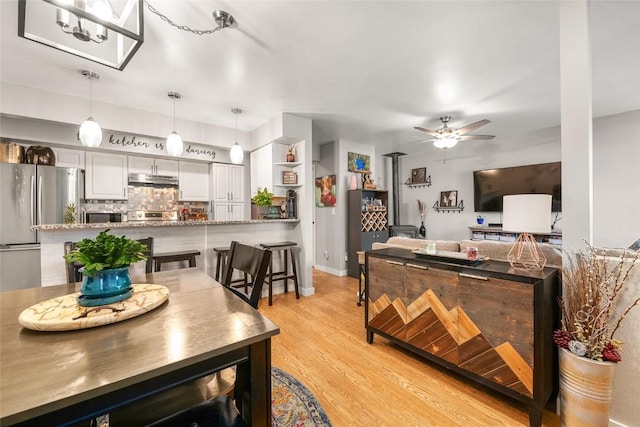 26 Cypress Ct Unit 26, Steamboat Springs, CO 80487 - dining area with ceiling fan and light wood-style floors