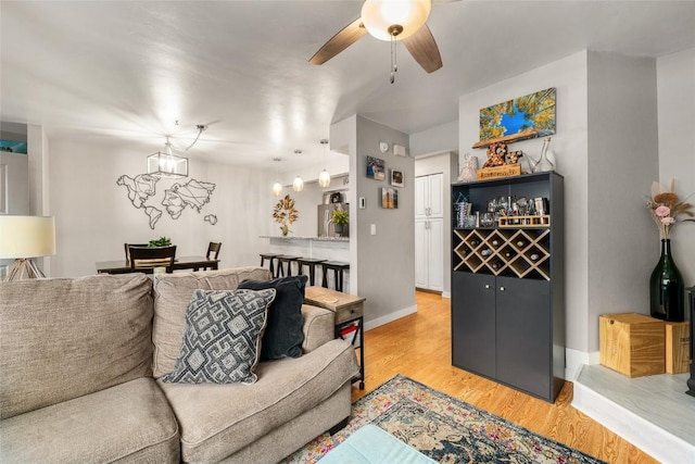 26 Cypress Ct Unit 26, Steamboat Springs, CO 80487 - living area featuring light wood finished floors, a ceiling fan, and baseboards