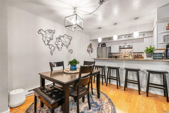 26 Cypress Ct Unit 26, Steamboat Springs, CO 80487 - dining space with light wood finished floors