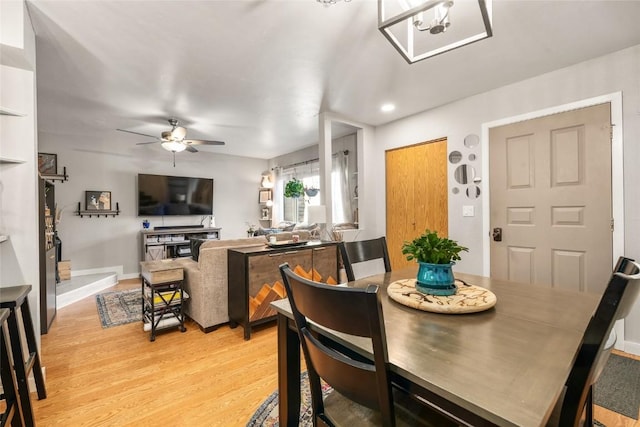26 Cypress Ct Unit 26, Steamboat Springs, CO 80487 - dining space with ceiling fan, baseboards, and light wood-style floors