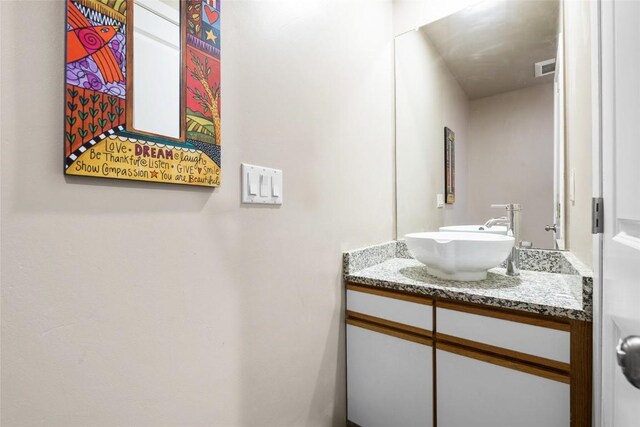 26 Cypress Ct Unit 26, Steamboat Springs, CO 80487 - bathroom featuring visible vents and vanity