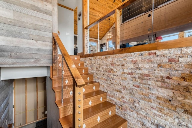 57415 Clara Way, Clark, CO 80428 - stairway with wood finished floors, lofted ceiling, brick wall, and wood ceiling