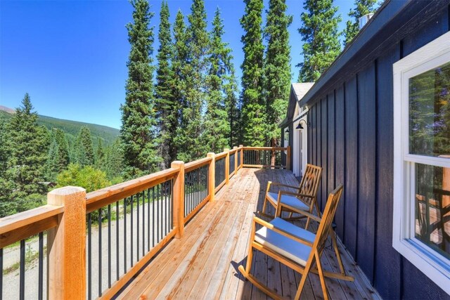 476 County Road 674, Breckenridge, CO 80424 - wooden terrace featuring a wooded view