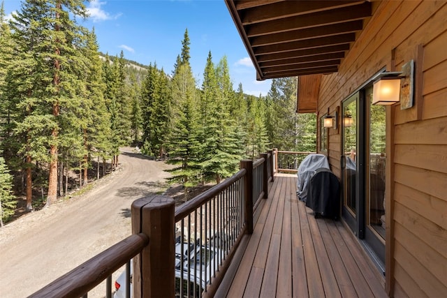 deck featuring a wooded view