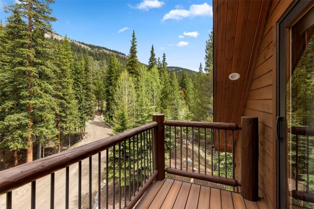 deck featuring a wooded view