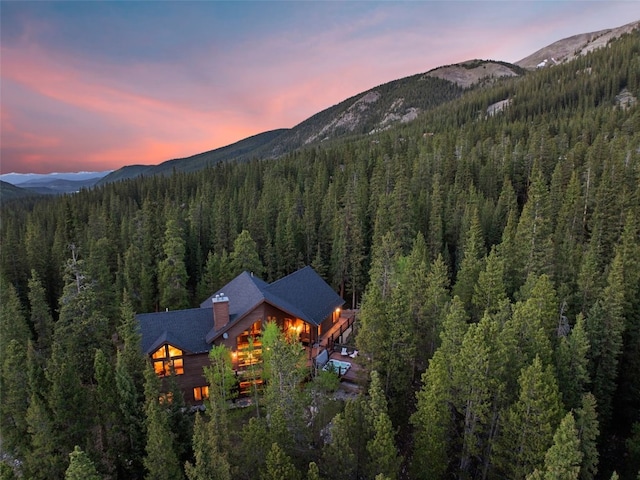 aerial view with a view of trees and a mountain view