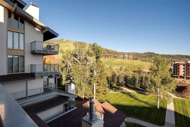 1920 Ski Time Square Dr Unit 402, Steamboat Springs, CO 80487 - view of yard featuring a mountain view and a balcony