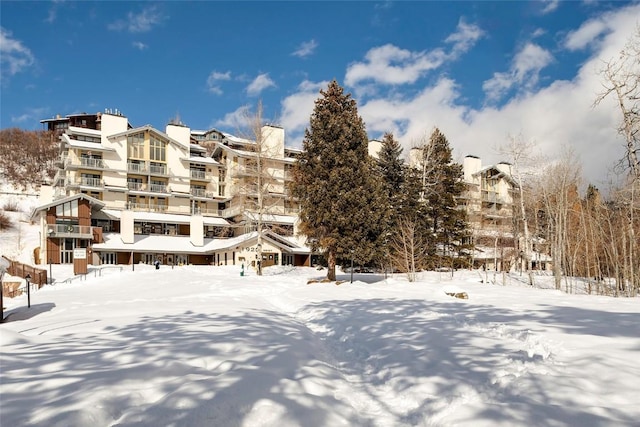 1920 Ski Time Square Dr Unit 402, Steamboat Springs, CO 80487 - snow covered building featuring a view of apartment building / complex