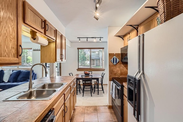 14 Crystal Cv Unit C14, Dillon, CO 80435 - kitchen with white fridge with ice dispenser, electric stove, rail lighting, tile countertops, and healthy amount of natural light