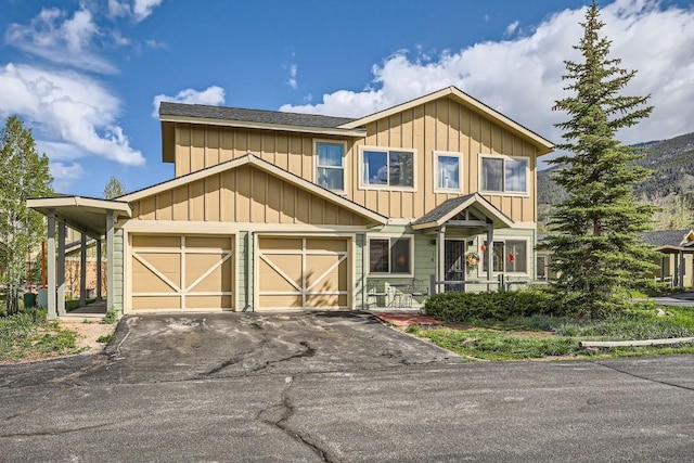 14 Crystal Cv Unit C14, Dillon, CO 80435 - view of front of house featuring driveway, board and batten siding, and an attached garage