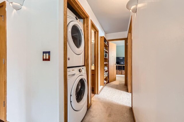 14 Crystal Cv Unit C14, Dillon, CO 80435 - laundry room featuring stacked washer / dryer and carpet flooring