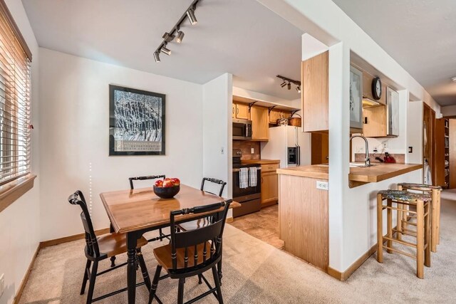 14 Crystal Cv Unit C14, Dillon, CO 80435 - dining room featuring track lighting and light carpet