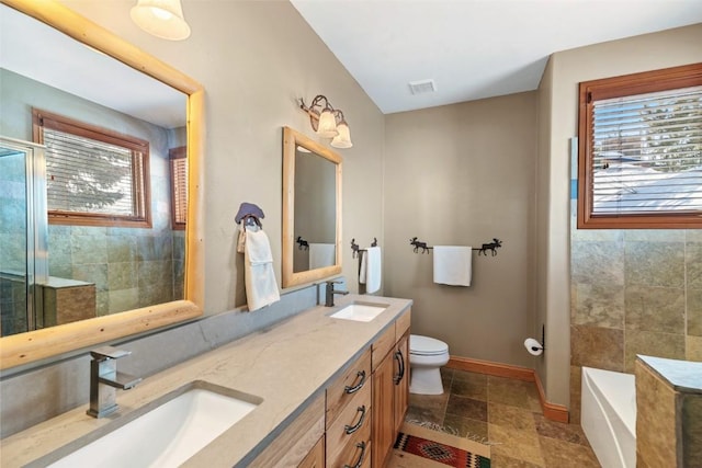 91791 Ryan Gulch Rd, Silverthorne, CO 80498 - full bath with plenty of natural light, baseboards, toilet, and double vanity