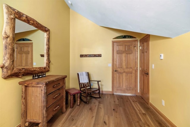 interior space featuring baseboards and light wood-type flooring