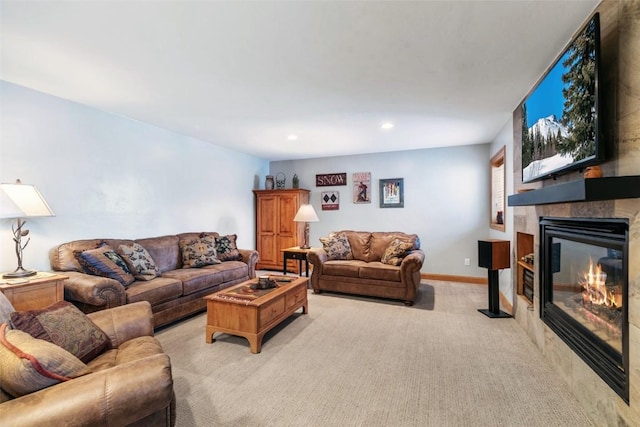 living room with recessed lighting, light carpet, and a fireplace