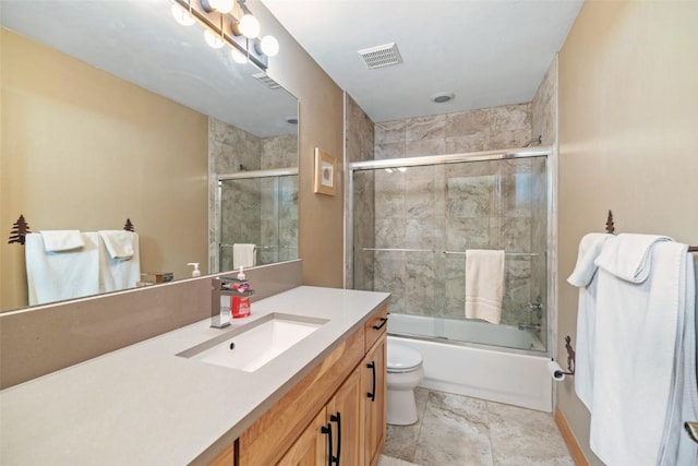 full bath featuring toilet, vanity, visible vents, and combined bath / shower with glass door