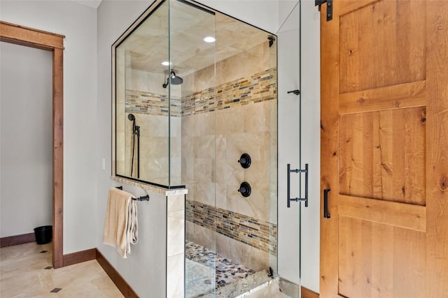 full bathroom featuring a stall shower and baseboards