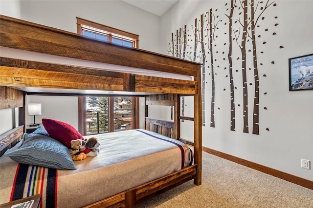 carpeted bedroom featuring baseboards