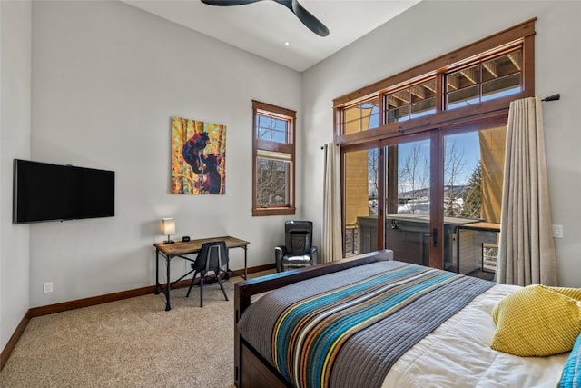 bedroom featuring baseboards, a ceiling fan, and light colored carpet