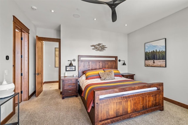 bedroom featuring baseboards, recessed lighting, and light colored carpet