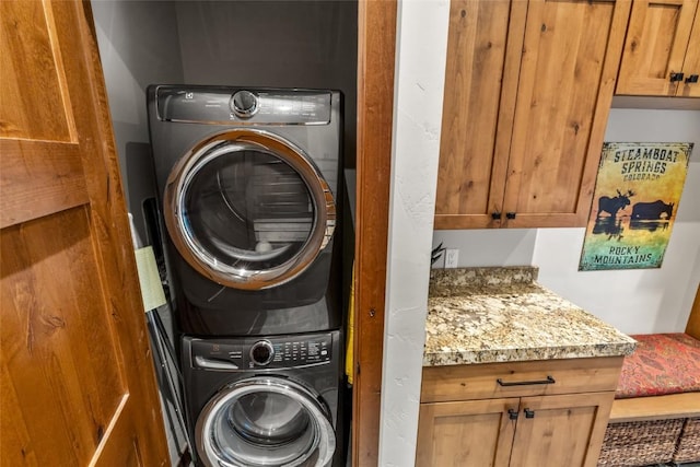 washroom featuring stacked washer and dryer