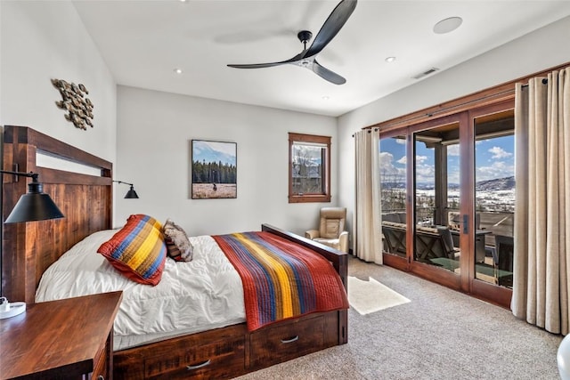 bedroom featuring ceiling fan, access to outside, carpet floors, and visible vents