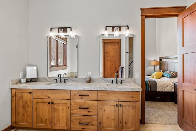 full bathroom featuring double vanity, a sink, and connected bathroom