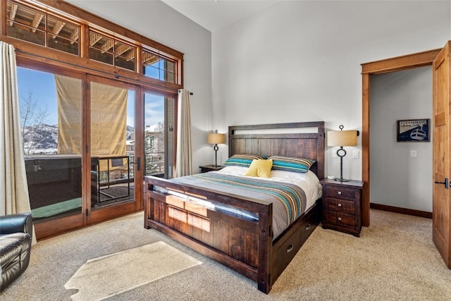 bedroom with baseboards, access to outside, and light colored carpet