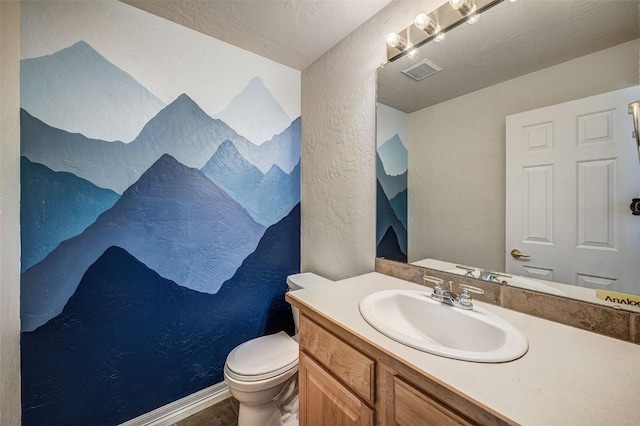 856 Kingdom Dr Unit 856, Breckenridge, CO 80424 - bathroom featuring toilet, a textured wall, and vanity