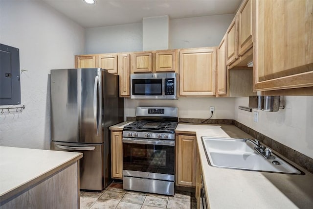 856 Kingdom Dr Unit 856, Breckenridge, CO 80424 - kitchen with appliances with stainless steel finishes, a sink, electric panel, light brown cabinets, and light countertops