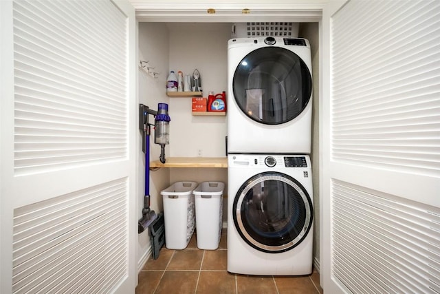 1485 Mustang Run Unit A, Steamboat Springs, CO 80487 - laundry area with stacked washer / dryer and tile patterned flooring