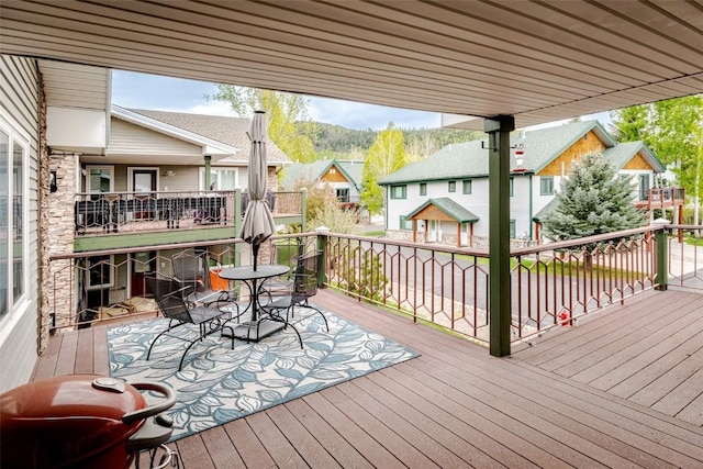 1485 Mustang Run Unit A, Steamboat Springs, CO 80487 - wooden deck featuring outdoor dining space and a residential view