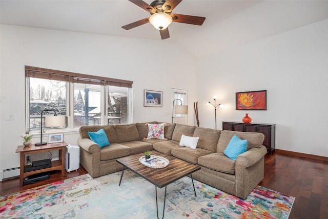 living area featuring vaulted ceiling, baseboards, a ceiling fan, wood finished floors, and a baseboard radiator