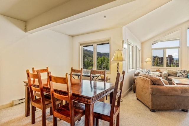 1724 Ski Time Square Dr Unit R5, Steamboat Springs, CO 80487 - dining space featuring a baseboard radiator, light carpet, baseboards, and vaulted ceiling