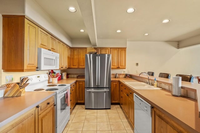 1724 Ski Time Square Dr Unit R5, Steamboat Springs, CO 80487 - kitchen featuring white appliances, a sink, light tile patterned floors, recessed lighting, and light countertops