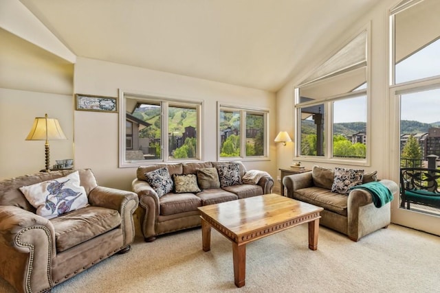 1724 Ski Time Square Dr Unit R5, Steamboat Springs, CO 80487 - living room featuring vaulted ceiling, healthy amount of natural light, and light colored carpet